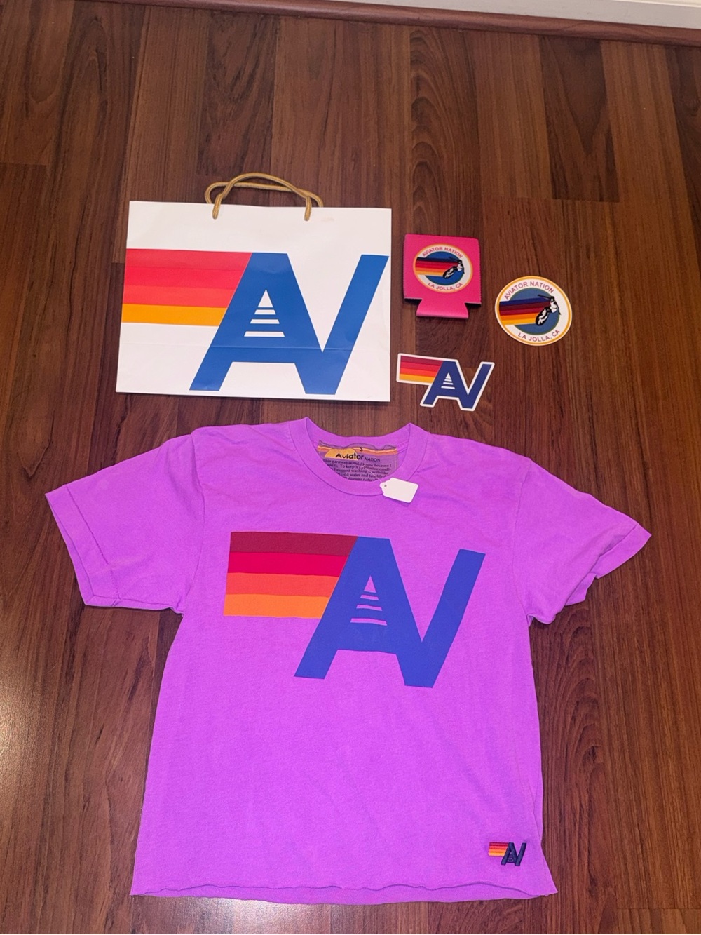 NWT Aviator Nation Women’s T Shirt Gift Bag Koozie Stickers Neon Purple Small